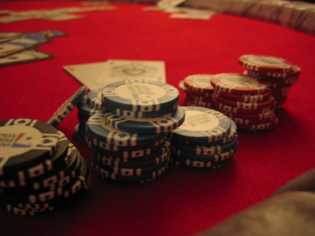 A diverse collection of online casino game icons including slot machine reels, roulette wheel, blackjack cards, and poker chips.